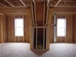 Attic view of two dormers lighting up an area as well as creating extra storage space